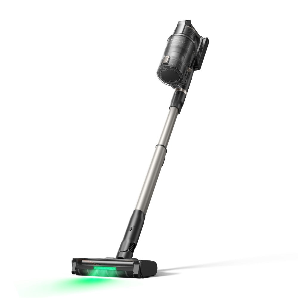 MOVA G70 cordless stick vacuum standing upright, its green LED floor light picking out dust on the floor