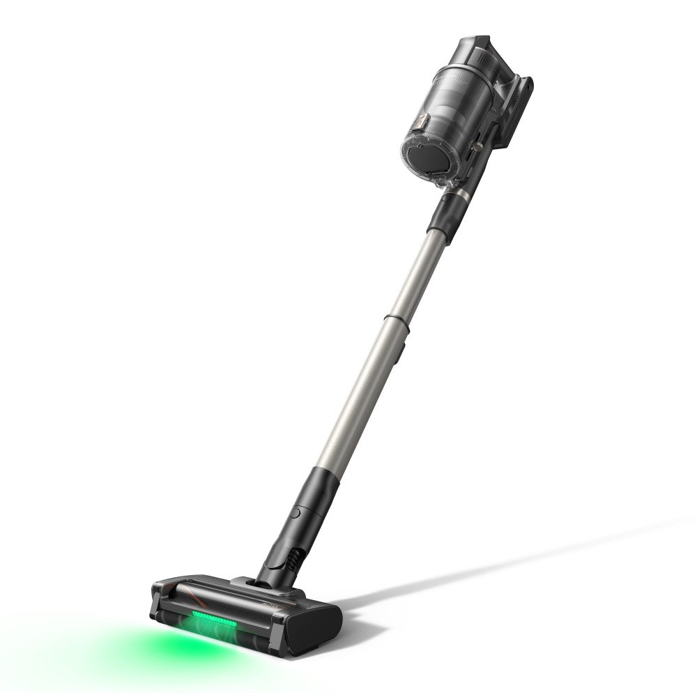 Wide-angle view of the MOVA G70 stick vacuum leaning at cleaning angle with its green floor head lit
